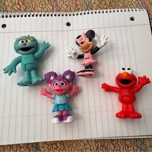 Colorful Sesame Street Neighborhood Friends and Minnie Mouse figurines